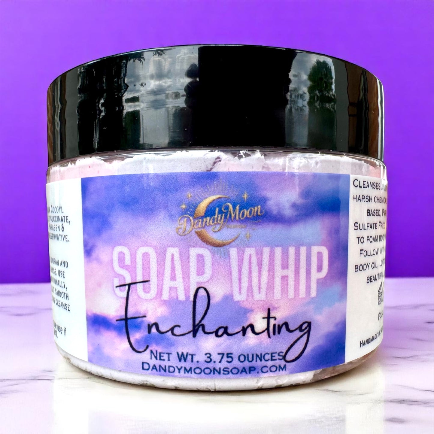 Jar of Dandy Moon Soap Whip Enchanting on a purple background