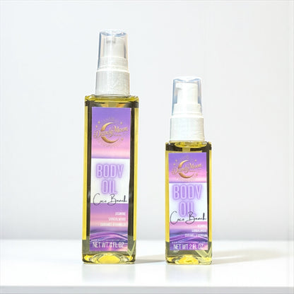 Two bottles of body oil, one is 2 ounces and one is 4 ounces, sitting on a white surface with a white background