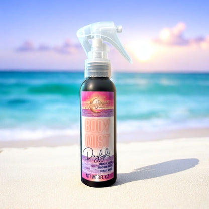 body mist spray bottle on a beach with a sunset in the background