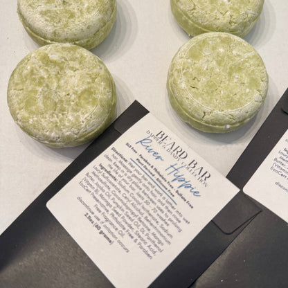 Green beard bar with packaging on a white surface