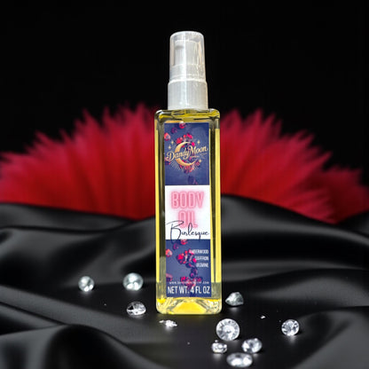 Bottle of body oil with decorative red feathers and diamonds scattered around it, on a black silk background