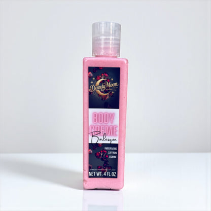 bottle of Dandy Moon body crème lotion, the lotion is a deep pink, against a white background