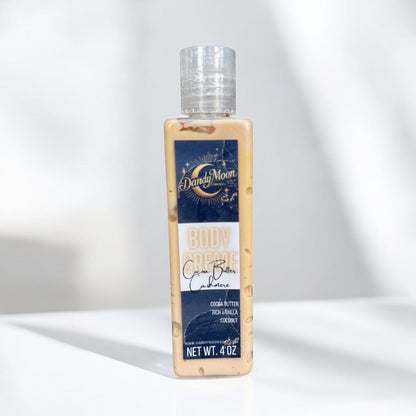 a bottle of body creme lotion in the scent cocoa butter cashmere stands on a white surface against a white background