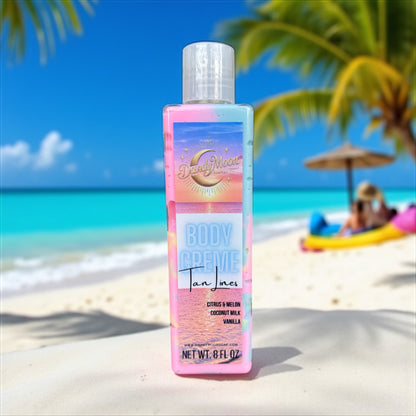 Bottle of Body Creme Lotion in the scent tan lines, the bottle is clear and the lotion inside is swirls of pink yellow and blue. the bottle sits on a beach with palm trees and blue sky blurred in the background. 
