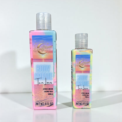 Two Bottles of Body Creme Lotion in the scent Tan lines. The bottles are clear and the lotion inside is swirls of yellow, pink, and blue. the bottles stand on a white surface against a white background 