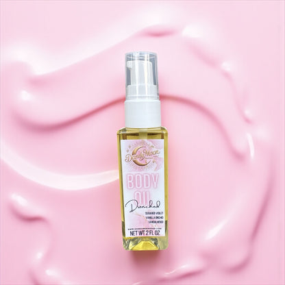 Bottle of body oil on a pink background
