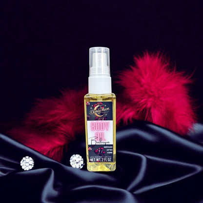 Bottle of body oil with red fur behind the bottle, and diamonds scattered around on a black silk background