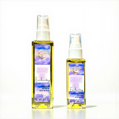 Two bottles of 'Body Oil Enchanting' on a white background