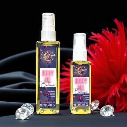 Two bottles of Burlesque scent body oils, one is 2 ounces and one is 4 ounces, with decorative elements or scattered diamonds and a red feather boa behind the bottles, against a silk fabric background