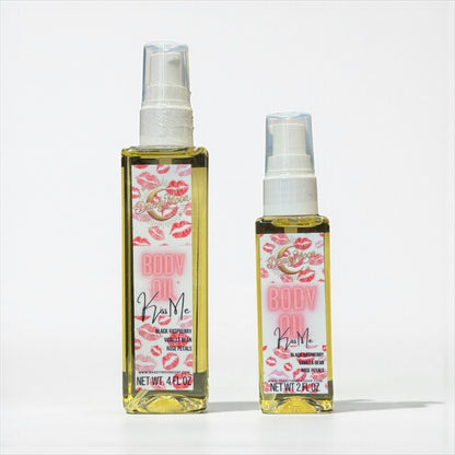 Two bottles of 'Body Oil', one is 4 ounces and one is 2 ounces, standing on a white surface against a white background