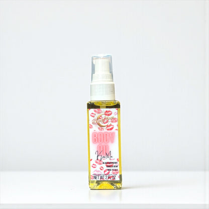 Body oil bottle with a decorative pink and red lips label on a white background