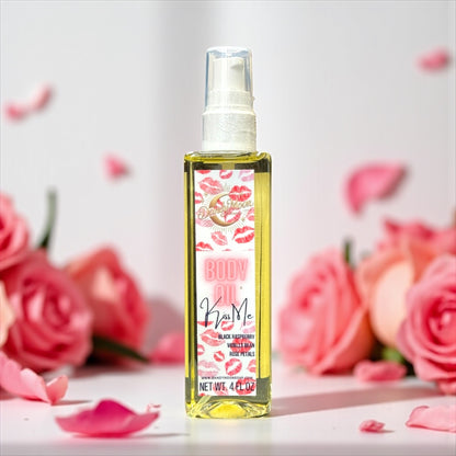 Bottle of body oil with floral design on label, surrounded by pink roses and petals.