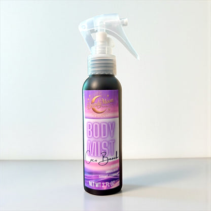 Body mist spray bottle with a colorful label on a white background